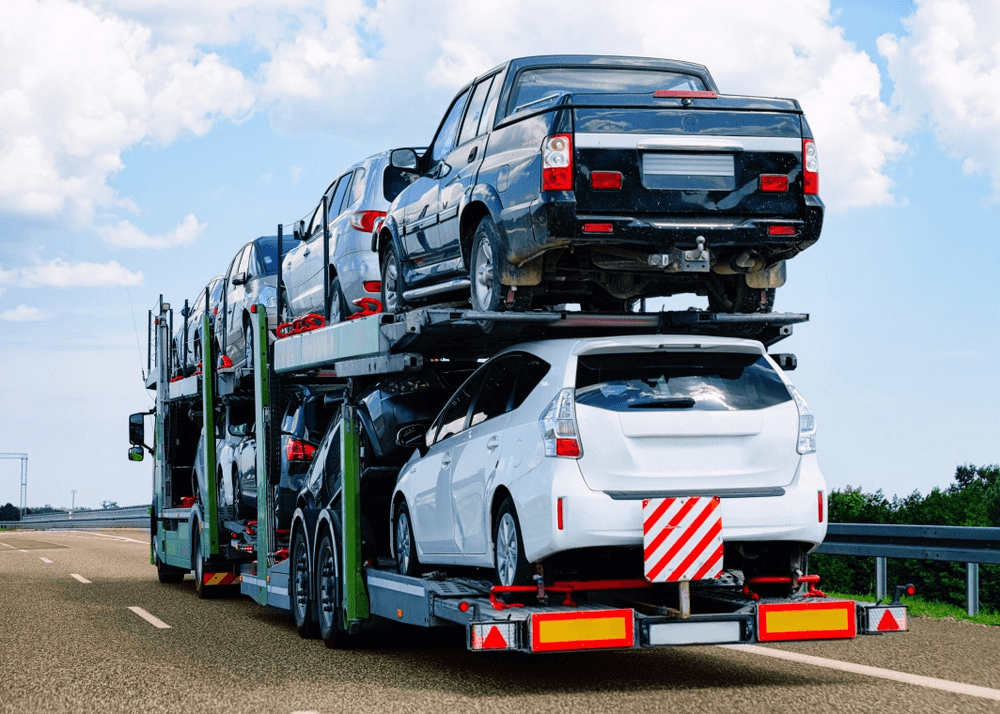 Vehicles loaded on a carrier for onward shipping